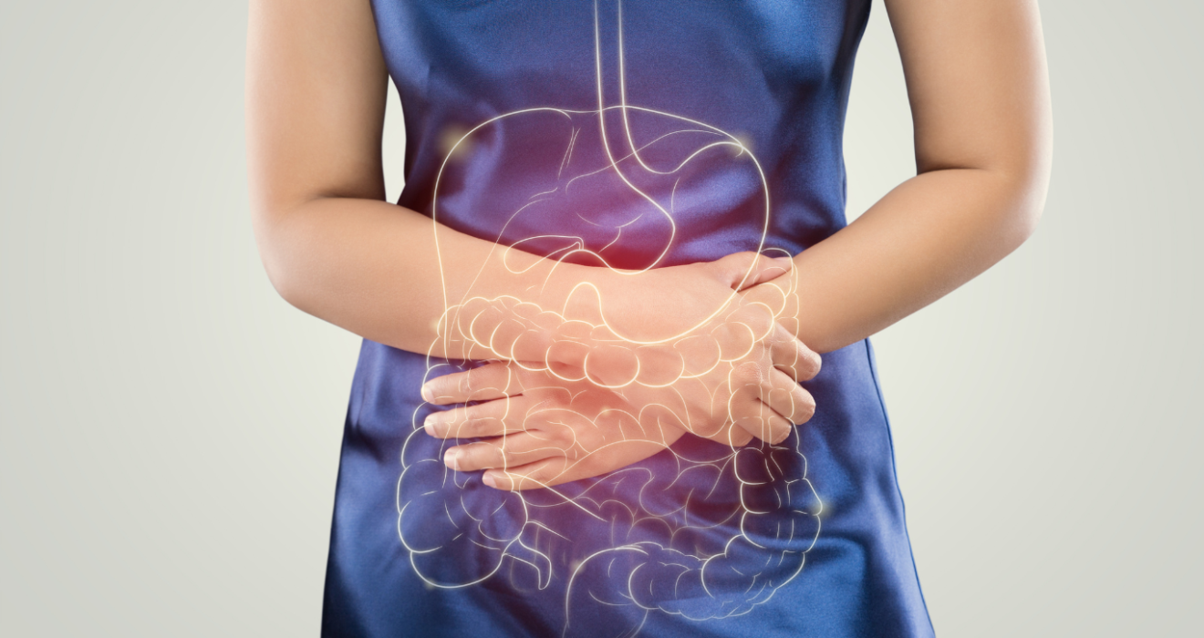 Ilustração de uma mulher com dor abdominal, destacando o sistema digestivo, relacionado ao tumor estromal gastrointestinal (GIST).
